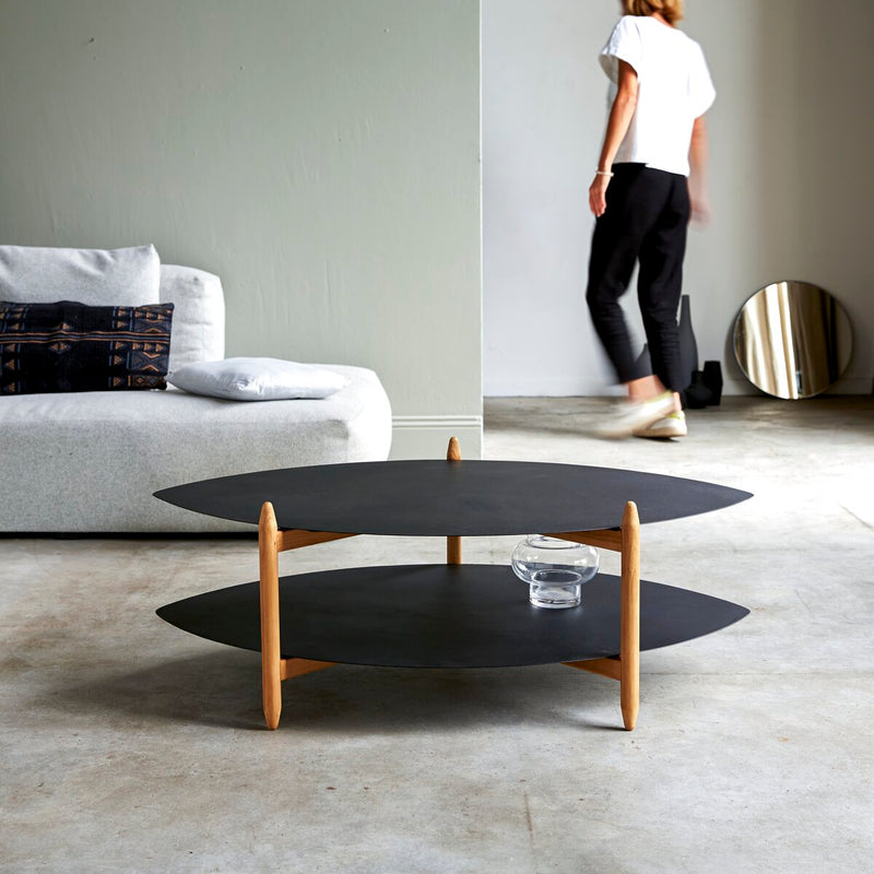 Suryavanshi Coffee Table – Black Powder-Coated Iron Top & Shelf, Mango Wood Legs (Oval, W110 D73 H39 cm)